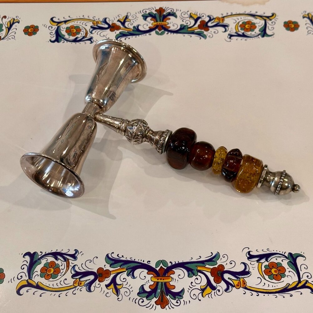 vintage double-sided shot glass - referred to as a jigger, featuring an amber-co